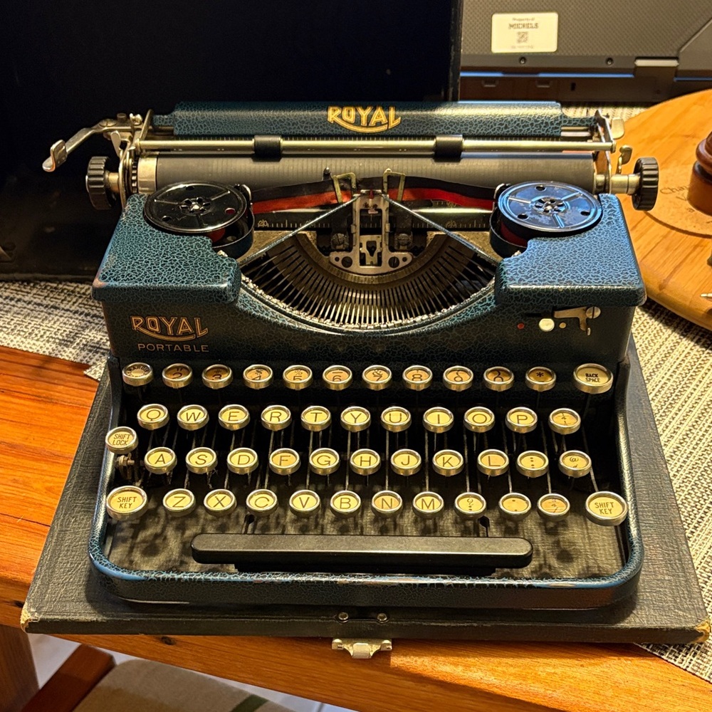 Royal Portable Blue and Black Typewriter with carrying case